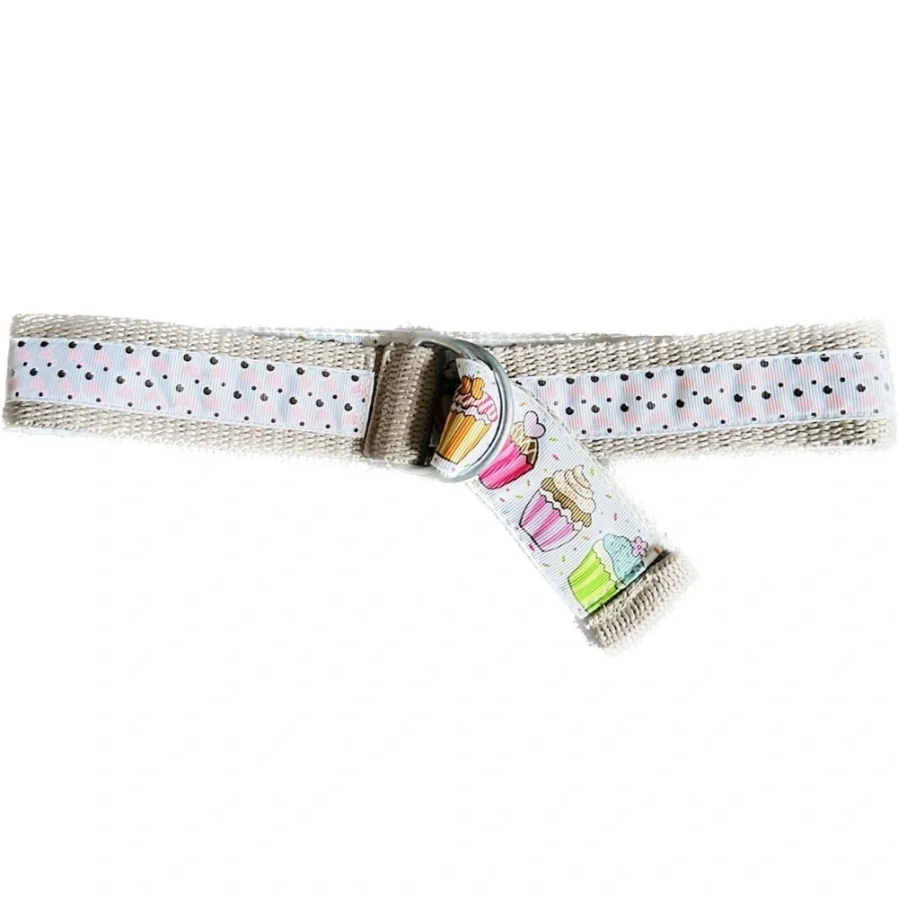 Belt, cupcakes and reverses to hearts on backside Celebrate in style.Adjustable